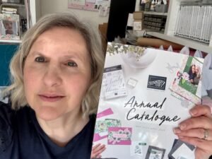 Inkabelle holding the New Annual Catalogue